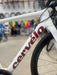 Cervelo bicycle frame with blurred background of a bike shop.