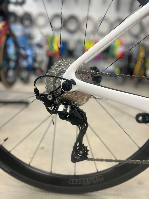 Close-up of a bicycle chain and gear system with blurred background