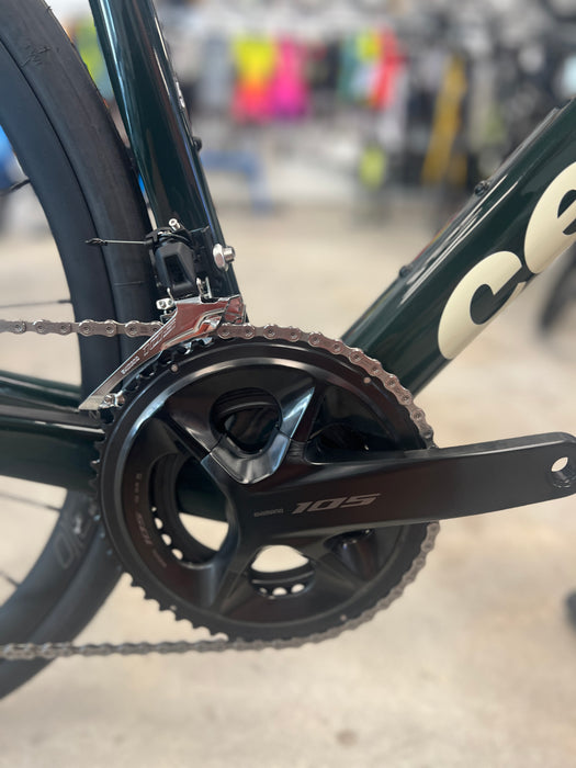 Close-up of a bicycle chain and gear system with a blurred background