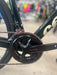 Close-up of a bicycle chain and gear system with a blurred background